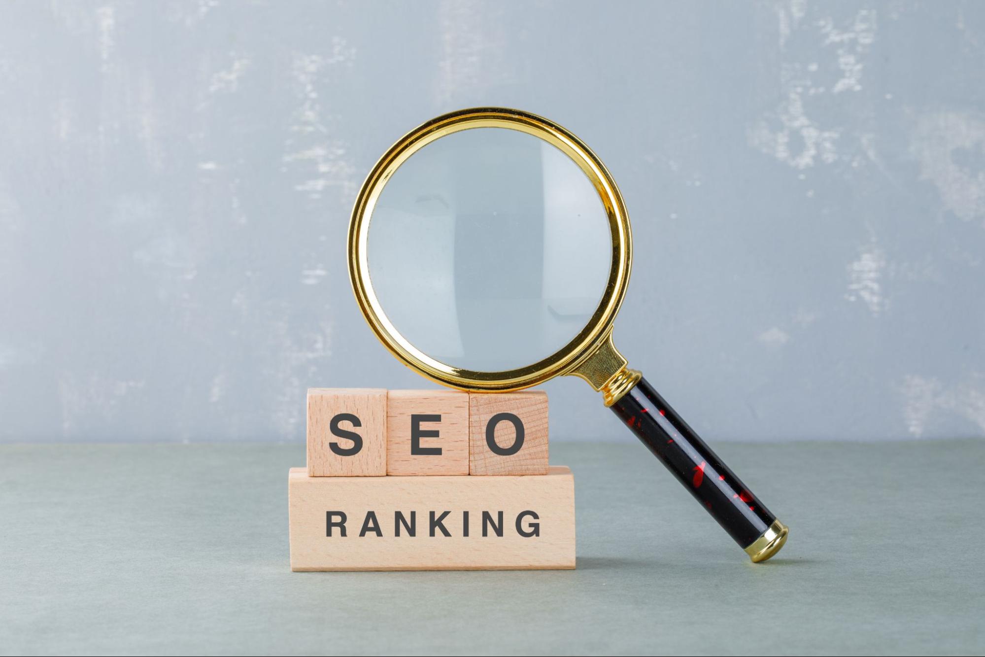 Magnifying glass highlighting SEO ranking, representing an AI-powered alternative to an SEO agency for startups focused on boosting search visibility.