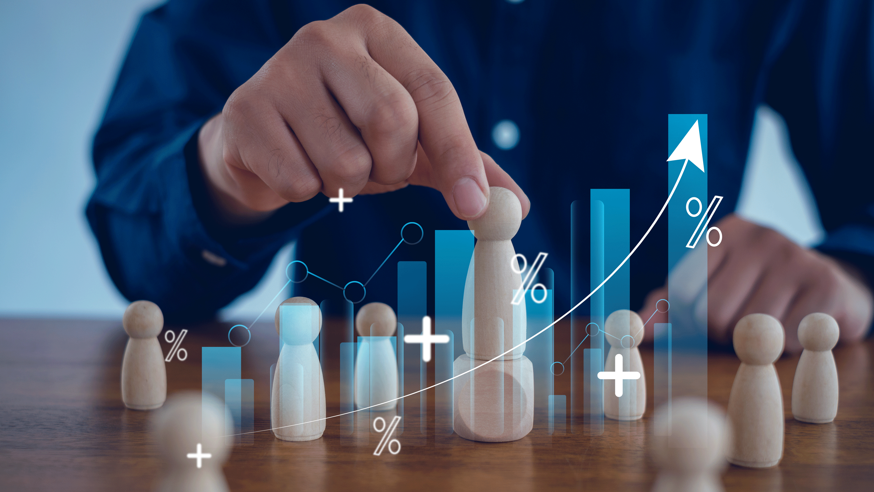 A person pointing at a board displaying a graph, illustrating data trends and insights.