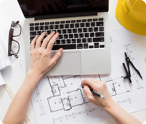 A person in a suit writes in a legal book at a desk, with a gavel and scales of justice nearby, conveying a professional legal setting.